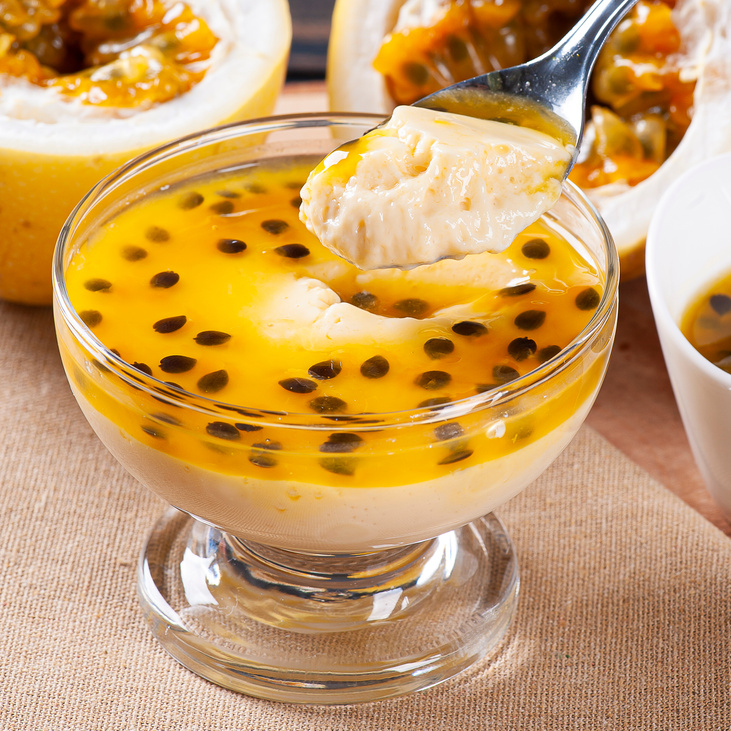 Passion fruit mousse. Refreshing dessert with fresh passion fruit topping